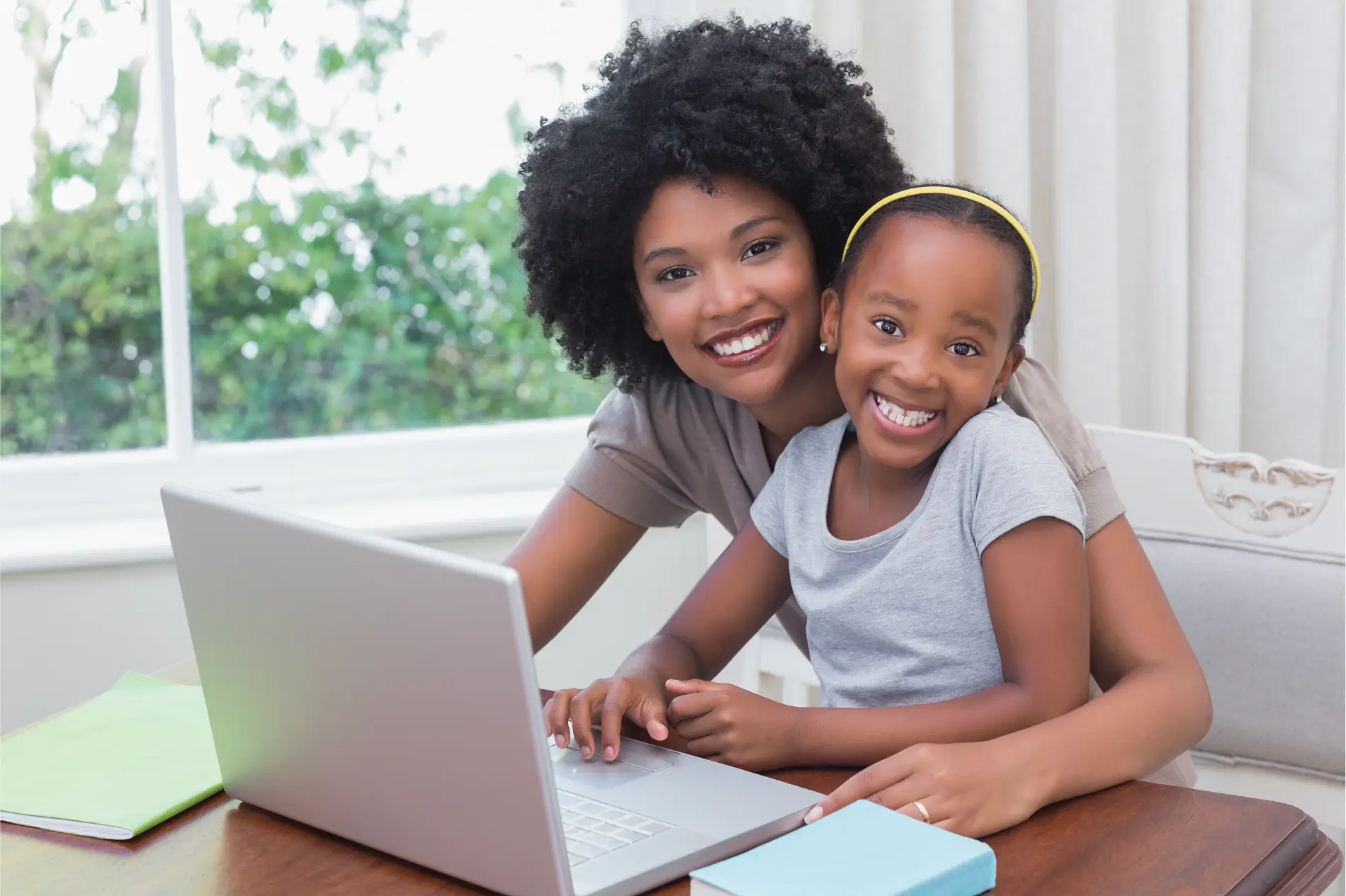 mom and daughter smiling